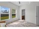 Bedroom with two windows and an ensuite bathroom, offering ample natural light at 3657 Daydream Pl, St Cloud, FL 34772