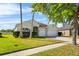 Beautiful single-story home boasts a manicured lawn, and a convenient two-car garage at 3657 Daydream Pl, St Cloud, FL 34772