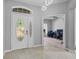 Front entryway with a decorative front door and an adjacent office space at 3657 Daydream Pl, St Cloud, FL 34772