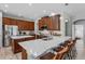 Gourmet kitchen boasts stainless appliances, a large center island, and breakfast bar seating at 3657 Daydream Pl, St Cloud, FL 34772