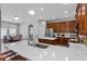 Open-concept kitchen with stainless steel appliances, large island, and breakfast bar at 3657 Daydream Pl, St Cloud, FL 34772