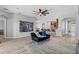 Spacious living room with wood flooring and open layout to kitchen and dining areas at 3657 Daydream Pl, St Cloud, FL 34772