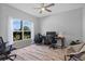 Home office features a large window, wood-look floors, and an inviting space for work at 3657 Daydream Pl, St Cloud, FL 34772