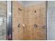 Close-up of the bathroom shower with double shower heads and tile surround at 3657 Daydream Pl, St Cloud, FL 34772