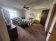 Bright bedroom featuring a sliding glass door access to the patio, ceiling fan, and carpet at 738 Adidas Rd, Winter Springs, FL 32708