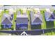 Birds eye view of suburban neighborhood showcasing the layout of the homes, driveways and lawns at 1142 Blarney St, Minneola, FL 34715