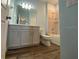 Clean and modern bathroom featuring a vanity and tiled shower and bathtub at 1142 Blarney St, Minneola, FL 34715