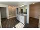 Bright bathroom boasts a walk-in shower, dual vanity with granite counters, and wood floors at 1142 Blarney St, Minneola, FL 34715