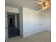 Bedroom with ceiling fan and double door closet at 1142 Blarney St, Minneola, FL 34715