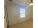 Bedroom with neutral carpet, ceiling fan, and window providing natural light at 1142 Blarney St, Minneola, FL 34715