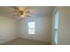Light and bright bedroom featuring a ceiling fan and window at 1142 Blarney St, Minneola, FL 34715