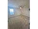 Spacious bedroom featuring a ceiling fan and a window providing natural light at 1142 Blarney St, Minneola, FL 34715