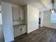 Cozy dining area featuring a built-in bar with granite countertop and white cabinets at 1142 Blarney St, Minneola, FL 34715