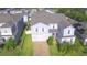 Beautiful two-story home with a well-manicured lawn and attached two car garage, located in a Gathering-friendly neighborhood at 1142 Blarney St, Minneola, FL 34715
