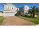 Charming two-story home featuring a brick driveway, two-car garage, and well-maintained landscaping at 1142 Blarney St, Minneola, FL 34715