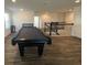 Large game room featuring a pool table and staircase to another floor at 1142 Blarney St, Minneola, FL 34715