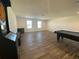 Game room features a pool table and dart board offering ample space for entertainment and leisure activities at 1142 Blarney St, Minneola, FL 34715