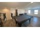 Game room with a pool table, game console and seating, accessible from the staircase at 1142 Blarney St, Minneola, FL 34715