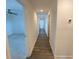 Bright hallway with wood floors leading to multiple rooms at 1142 Blarney St, Minneola, FL 34715