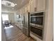 Well-equipped kitchen boasting stainless steel appliances, including a double oven, and stylish cabinetry at 1142 Blarney St, Minneola, FL 34715