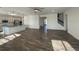 Spacious open-concept home featuring hardwood floors, an island kitchen, and a staircase to the second floor at 1142 Blarney St, Minneola, FL 34715