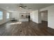 Open-concept living and dining area boasts lots of natural light and hardwood floors at 1142 Blarney St, Minneola, FL 34715
