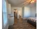 Spacious main bedroom featuring wood floors, ceiling fan and an ensuite bathroom at 1142 Blarney St, Minneola, FL 34715