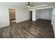 Bright main bedroom with wood floors and an ensuite bathroom at 1142 Blarney St, Minneola, FL 34715