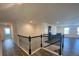 View of a staircase featuring black metal and wood railings at 1142 Blarney St, Minneola, FL 34715
