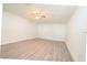 Large bedroom featuring light gray floors and a ceiling fan at 1501 7Th Se St, Winter Haven, FL 33880