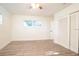 Bedroom features wood-look flooring, windows, and closet at 1501 7Th Se St, Winter Haven, FL 33880