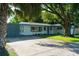 Charming single-story home with a well-maintained lawn and mature trees at 1501 7Th Se St, Winter Haven, FL 33880