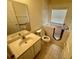 Bathroom with tile floors, walk-in tub and separate vanity at 1003 Clearpointe Way, Lakeland, FL 33813