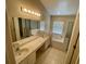 Bright bathroom boasts a double vanity, large mirror, soaking tub and separate shower at 1003 Clearpointe Way, Lakeland, FL 33813