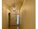 Bright foyer with ceramic tile floors and a decorative light fixture in a neutrally painted home at 1003 Clearpointe Way, Lakeland, FL 33813