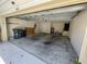 A two car garage with open door showing cement flooring at 1003 Clearpointe Way, Lakeland, FL 33813