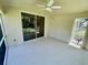 Enclosed patio features a ceiling fan, access to the outdoors, and a tranquil space at 1003 Clearpointe Way, Lakeland, FL 33813