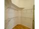 A spacious walk-in closet featuring wire racks and wood floors at 1003 Clearpointe Way, Lakeland, FL 33813