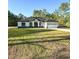 Charming single-story home with a well-manicured lawn and attached two-car garage at 13619 Sw 78Th Pl, Dunnellon, FL 34432
