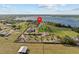 Aerial view of large farm with surrounding trees and a beautiful lake at 6820 County Road 561, Clermont, FL 34714