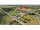 High angle view of a sprawling estate, showcasing equestrian facilities, manicured lawns, and a winding driveway at 6820 County Road 561, Clermont, FL 34714