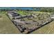 Aerial shot of a fenced horse farm with multiple outbuildings at 6820 County Road 561, Clermont, FL 34714