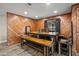 The charming dining area features a rustic wooden table and bench seating at 6820 County Road 561, Clermont, FL 34714