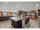 Spacious kitchen features a central island, dark wood cabinets, and stainless steel appliances at 6820 County Road 561, Clermont, FL 34714