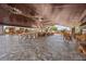 Large covered patio showcasing stone floors and artisan furniture at 6820 County Road 561, Clermont, FL 34714