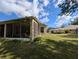 Back porch is screened in for comfort at 5352 Treasure View Way, Leesburg, FL 34748