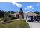 Lovely single-Gathering home with well-maintained landscaping, on a sunny day at 5352 Treasure View Way, Leesburg, FL 34748