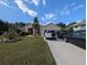 Beautiful one-story home with a cozy front yard and private driveway at 5352 Treasure View Way, Leesburg, FL 34748