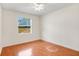Bedroom with wood laminate floors and a bright window at 1125 English Garden Ln, Winter Garden, FL 34787