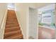 Hallway and stairs next to a closet and a bedroom with a safari mural at 1125 English Garden Ln, Winter Garden, FL 34787